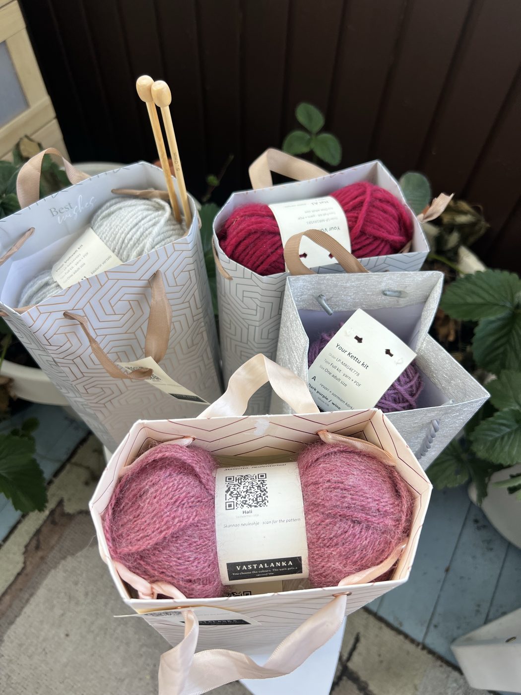Several Vastalanka kits ready to ship together, showing the range of repurposed bags used