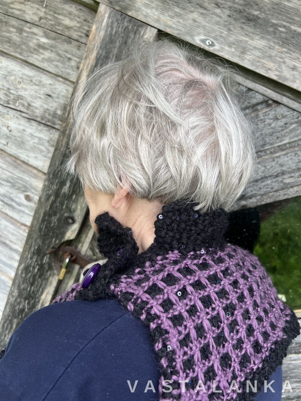 Back view of the Vohveli cowl worn by a model
